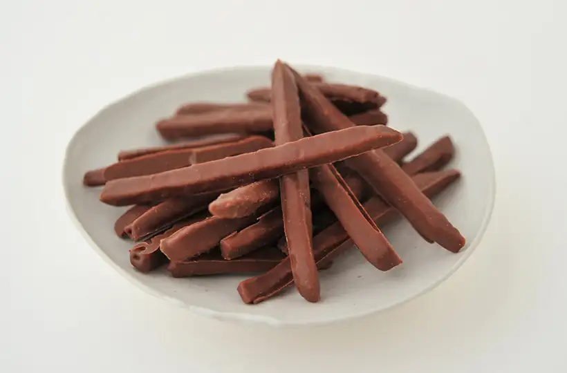 チョコがけけんぴ（ミルクチョコ）｜袋入り商品｜│芋屋金次郎